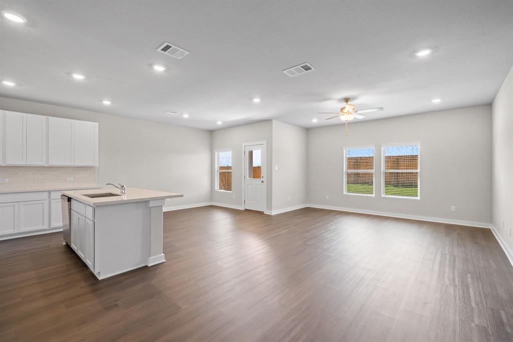 177 Sleep Hollow Jarrell, TX 76537 - Photo 10 of 24 Open-concept living space featuring wood-finish flooring, recessed lighting, and a ceiling fan