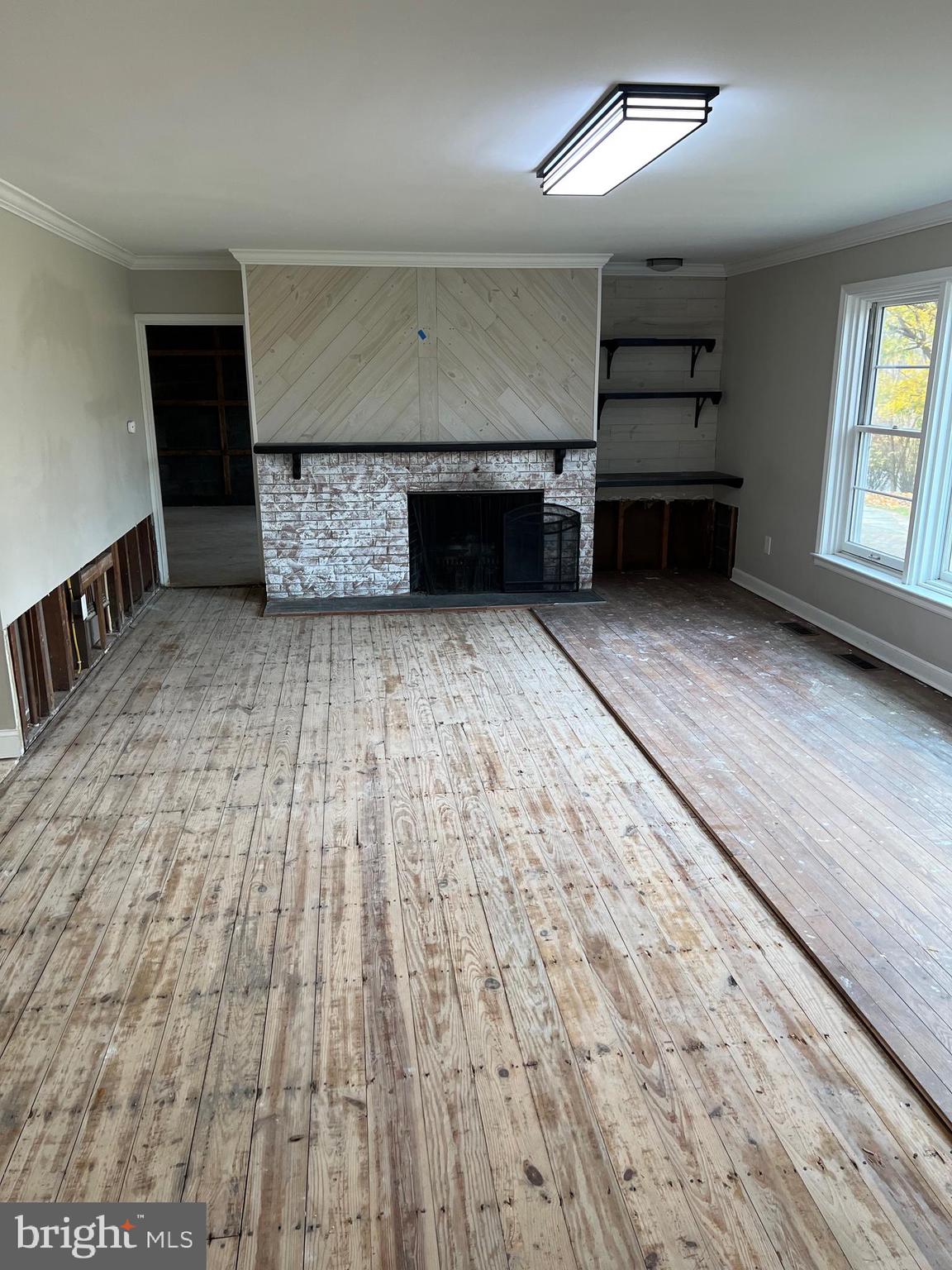 202 Museum Road Shillington, PA 19607 - Photo 12 of 29 an empty room with wooden floor and windows