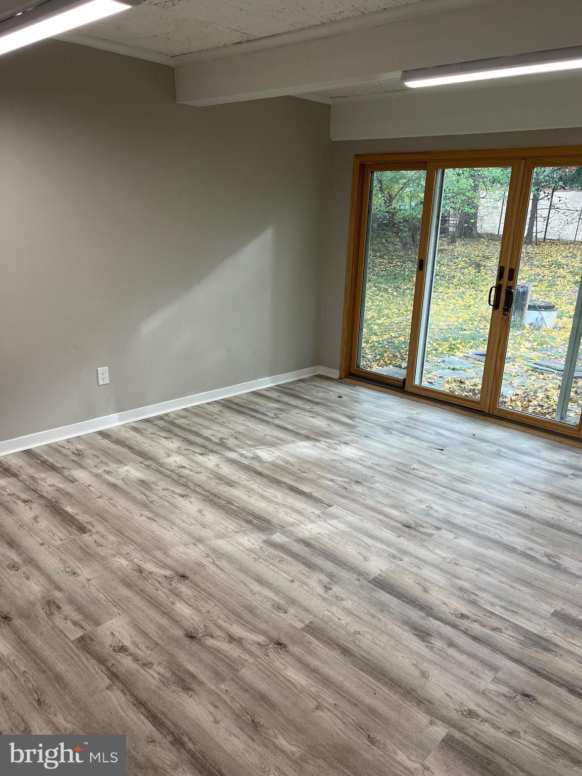 202 Museum Road Shillington, PA 19607 - Photo 15 of 29 a view of an empty room with wooden floor and a window