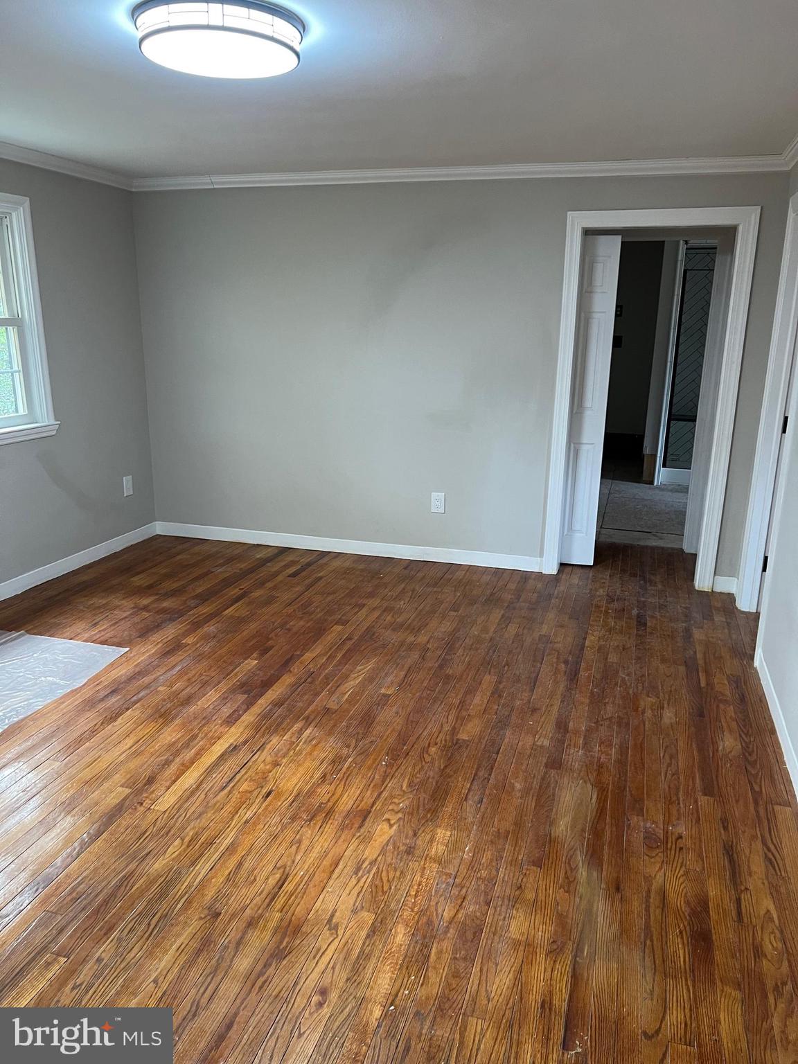 202 Museum Road Shillington, PA 19607 - Photo 18 of 29 an empty room with wooden floor and windows