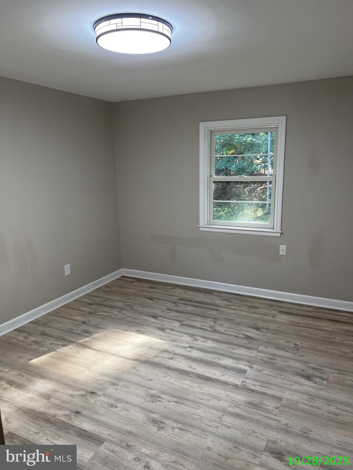 202 Museum Road Shillington, PA 19607 - Photo 26 of 29 an empty room with wooden floor and windows