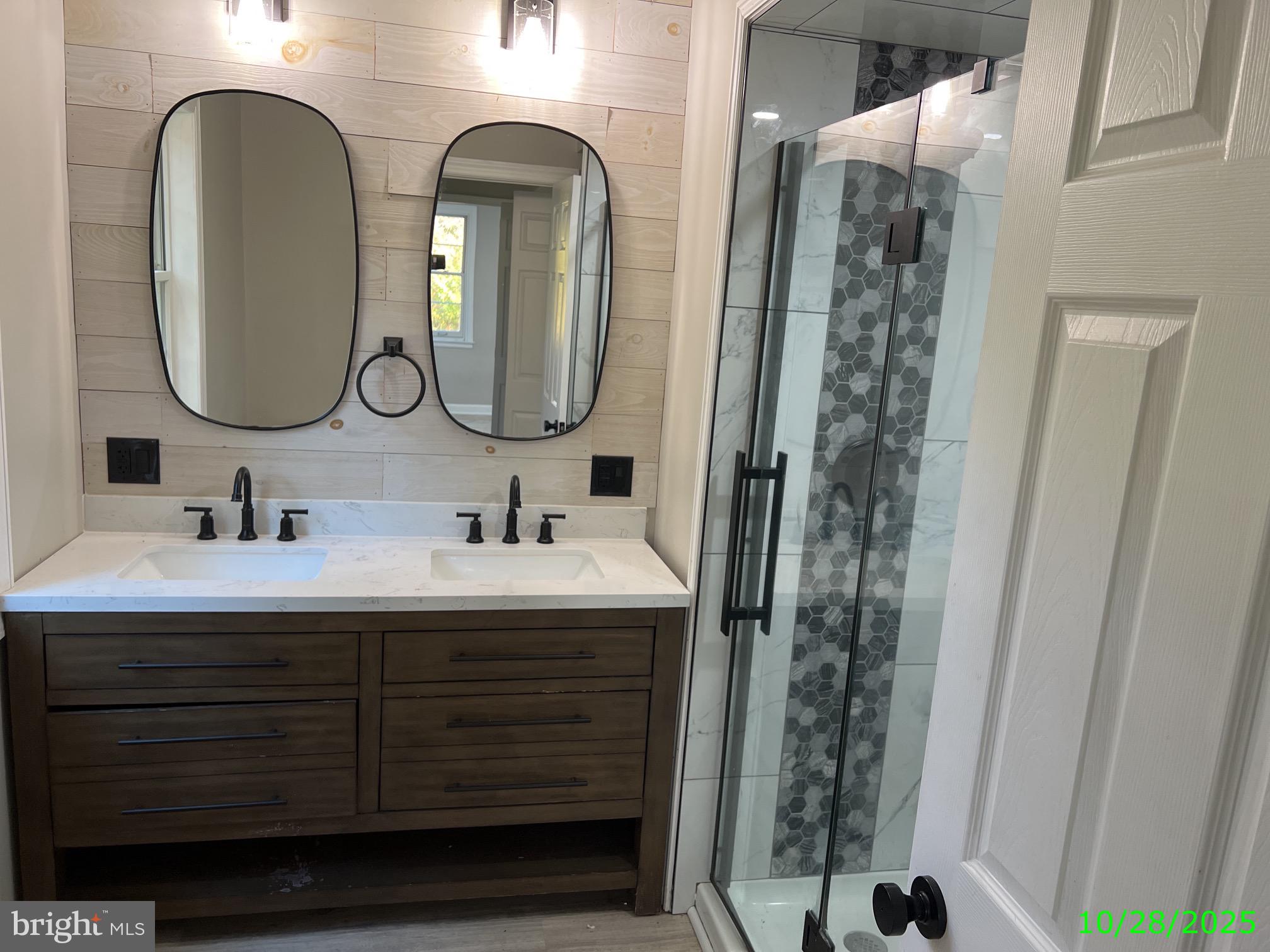 202 Museum Road Shillington, PA 19607 - Photo 29 of 29 a bathroom with a double vanity sink and a mirror