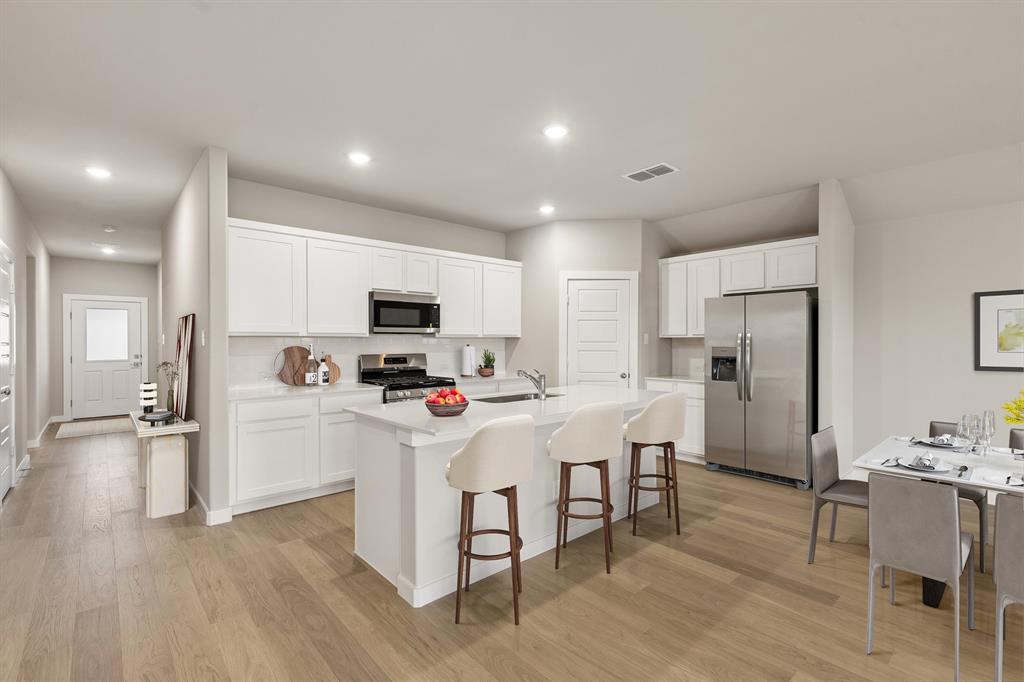 1124 Del Rio Drive Lavon, TX 75166 - Photo 4 of 32 Kitchen in the Emmy II home plan by Trophy Signature Homes - REPRESENTATIVE PHOTO