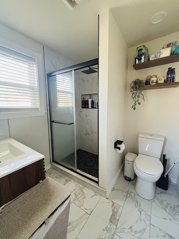 31 Garland Street, Unit 1 Chelsea, MA 02150 - Photo 4 of 9 a bathroom with a sink toilet and shower