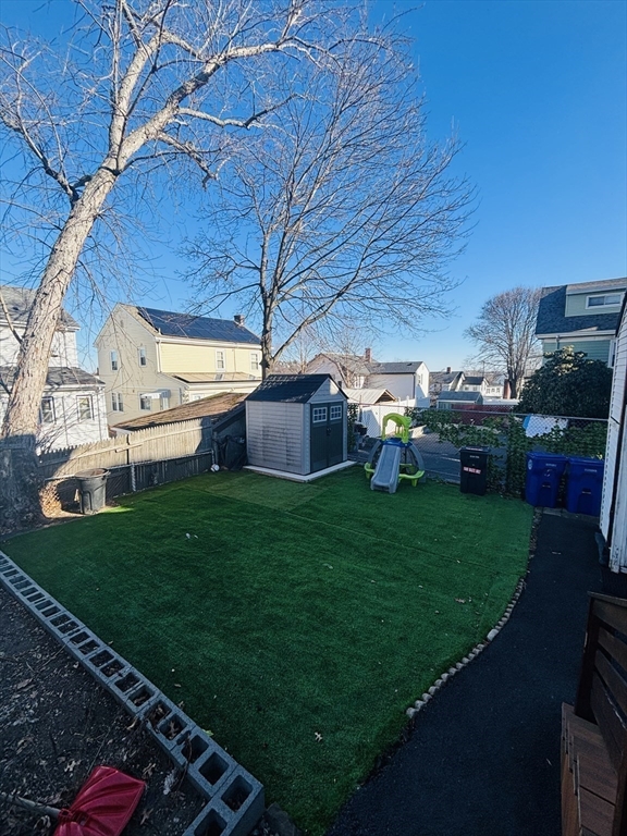 31 Garland Street, Unit 1 Chelsea, MA 02150 - Photo 8 of 9 a view of yard with patio