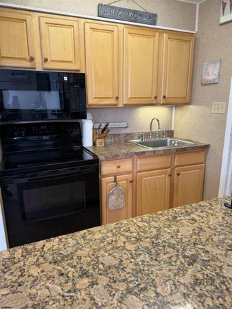 a kitchen with a stove and a sink
