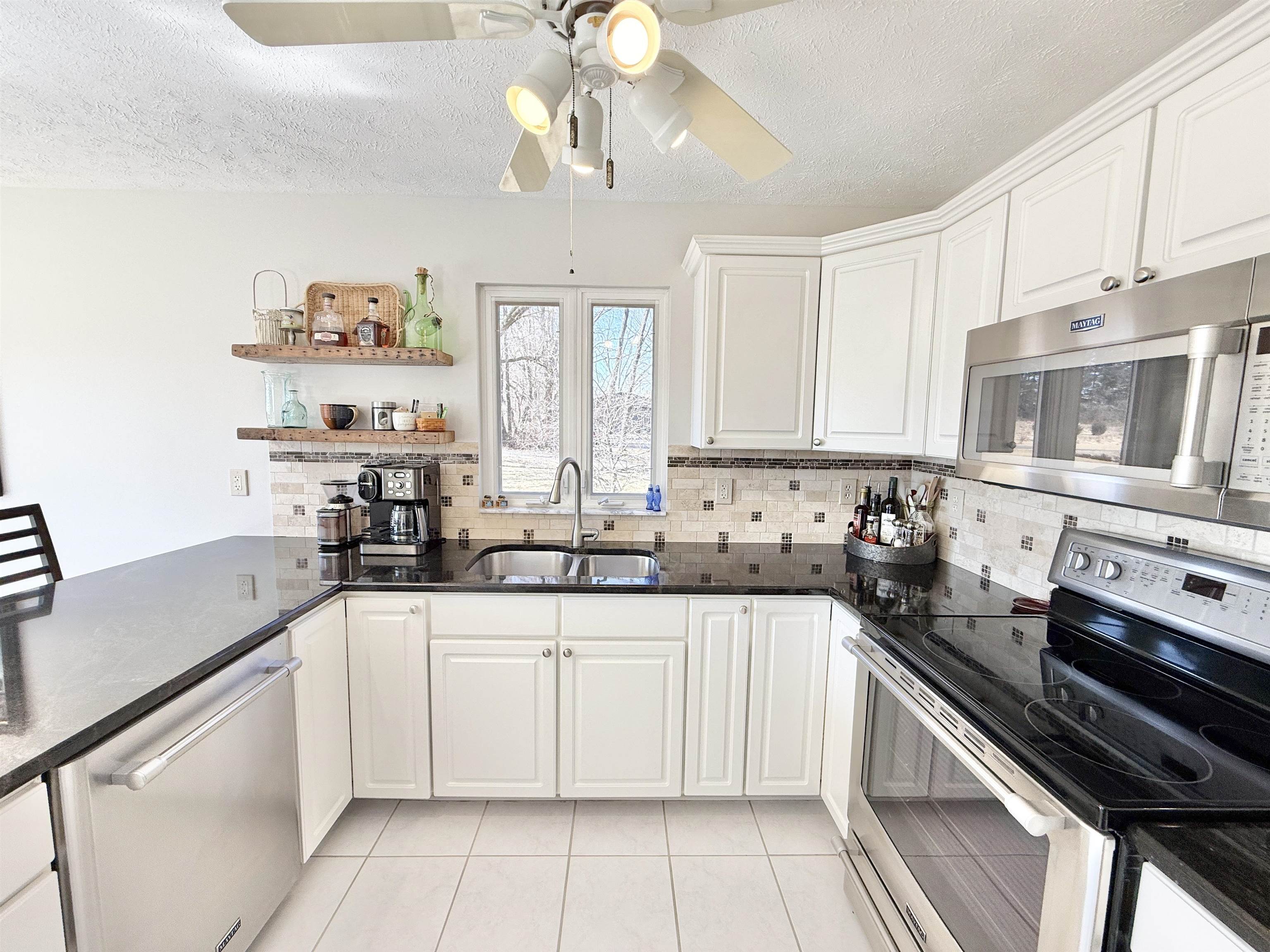 7188 Edwardsville Road Rockford, IL 61102 - Photo 20 of 73 a kitchen with a sink cabinets and window