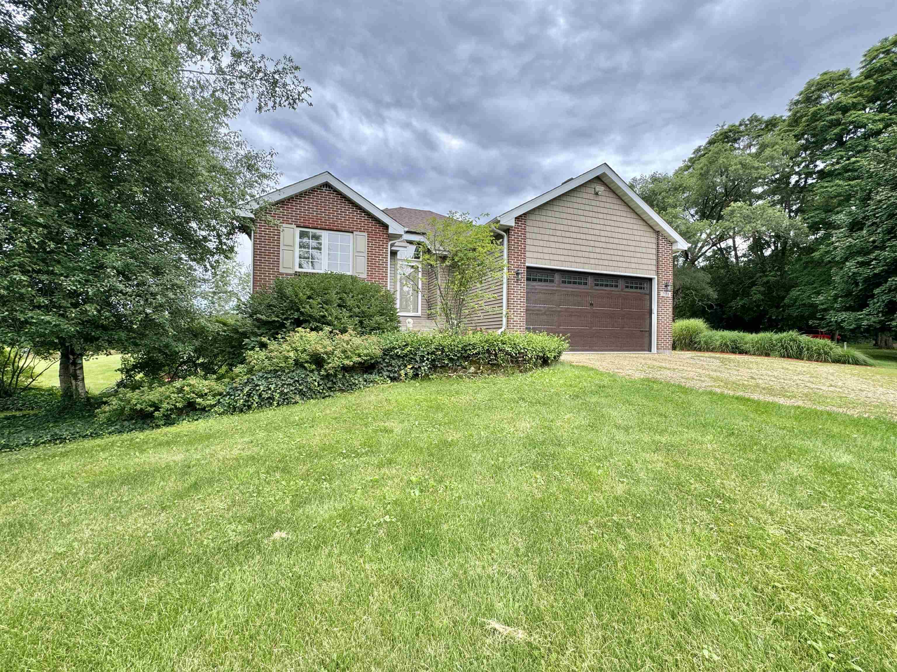 7188 Edwardsville Road Rockford, IL 61102 - Photo 2 of 73 a house with garden in front of it