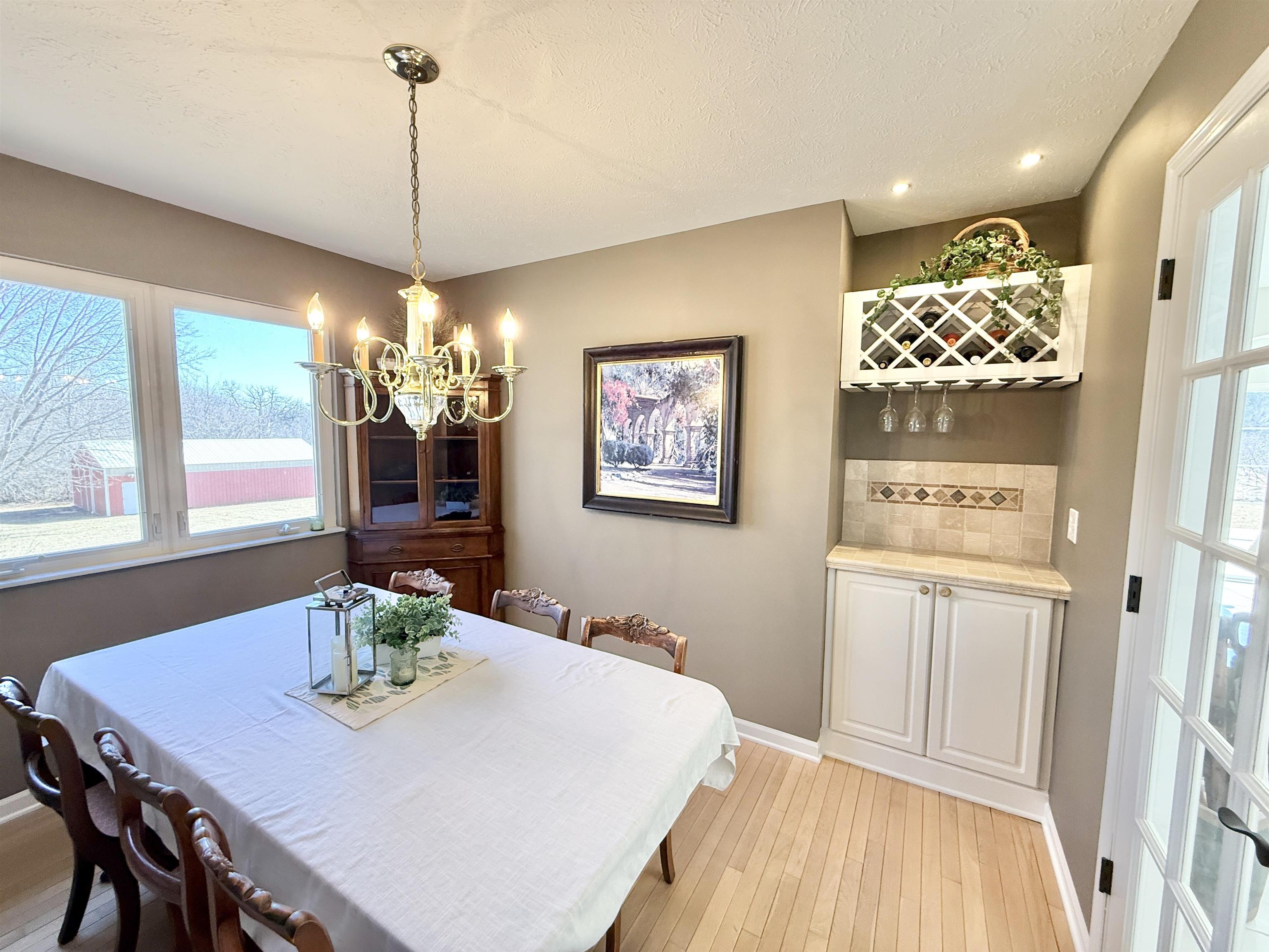 7188 Edwardsville Road Rockford, IL 61102 - Photo 27 of 73 a view of a dining room with furniture window and wooden floor