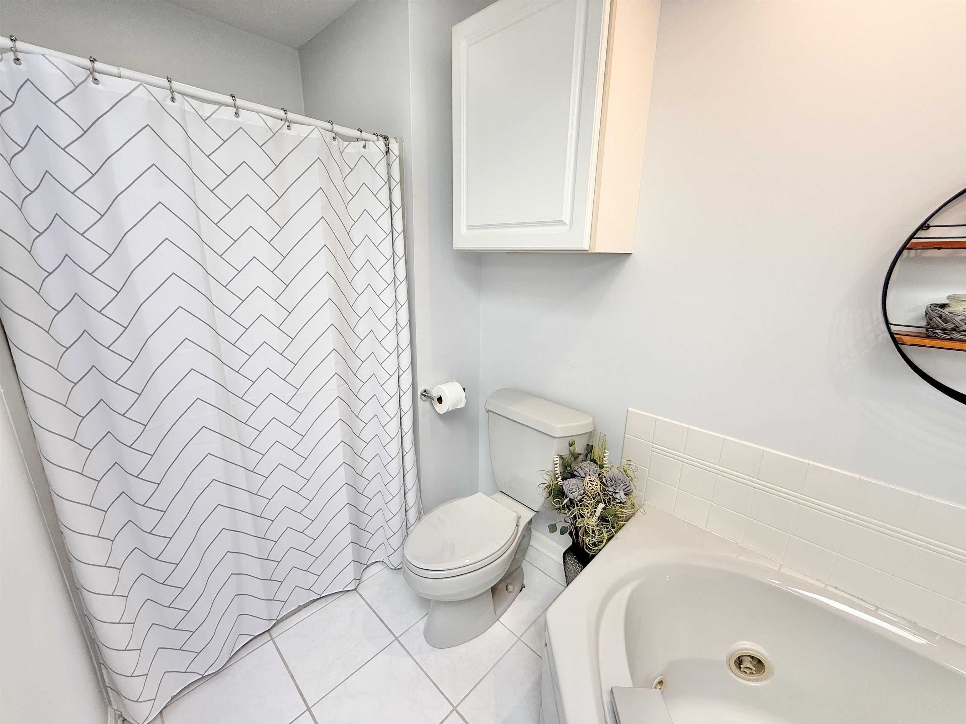 7188 Edwardsville Road Rockford, IL 61102 - Photo 32 of 73 a bathroom with a sink a toilet and a bathtub