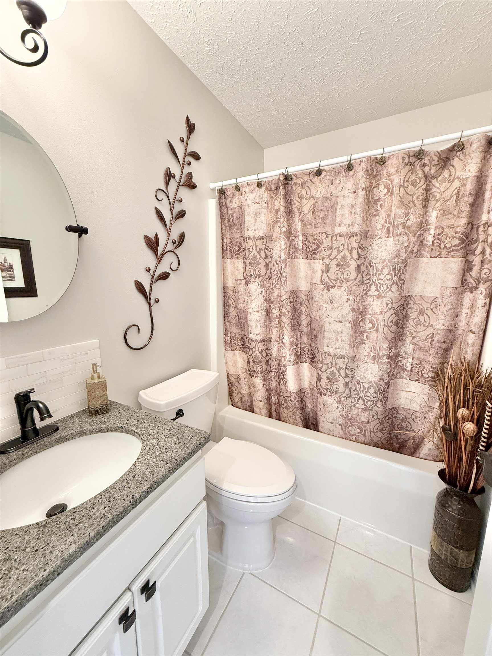 7188 Edwardsville Road Rockford, IL 61102 - Photo 35 of 73 a bathroom with a granite countertop sink a toilet and a mirror