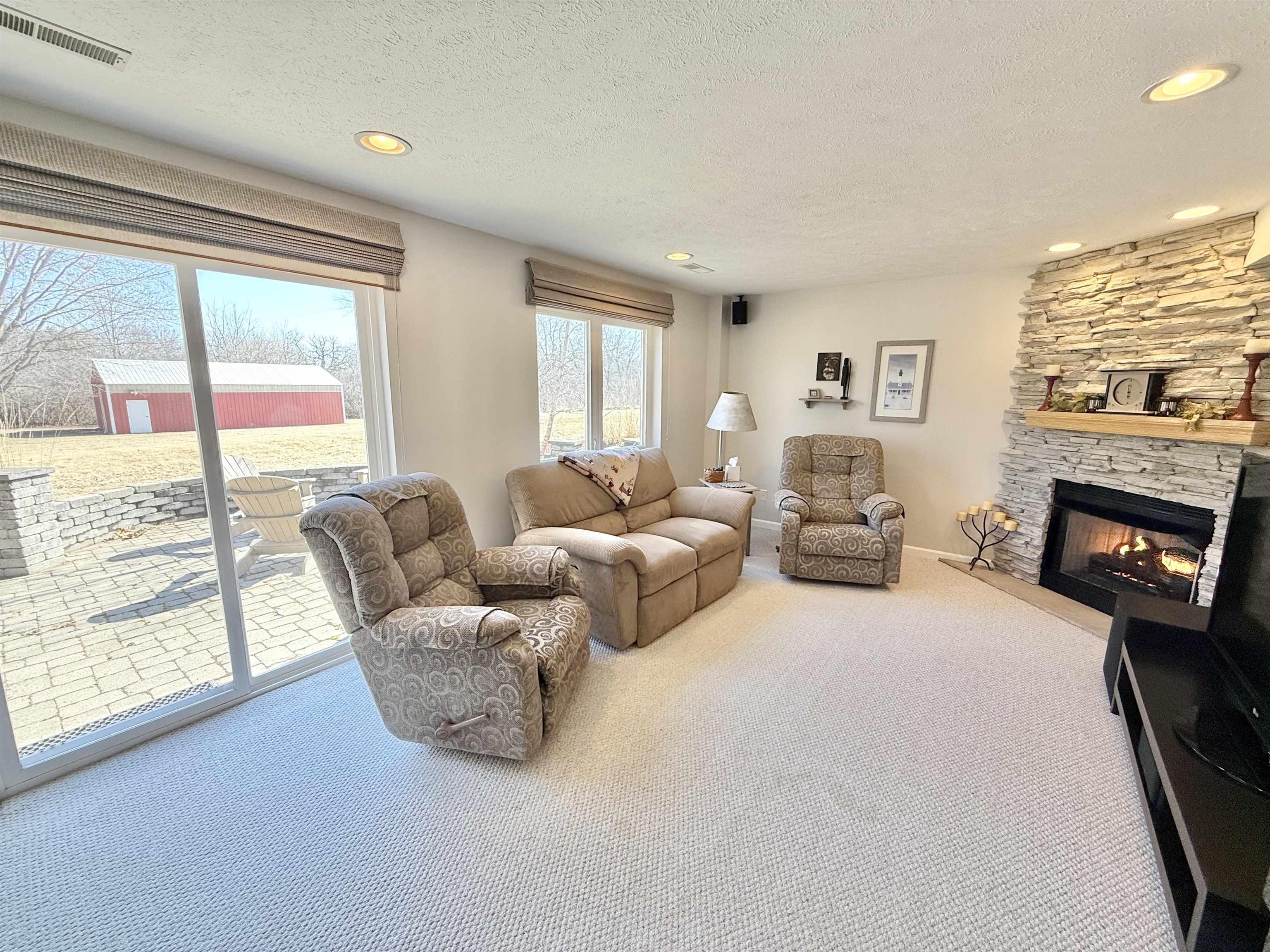 7188 Edwardsville Road Rockford, IL 61102 - Photo 39 of 73 a living room with furniture and a fireplace
