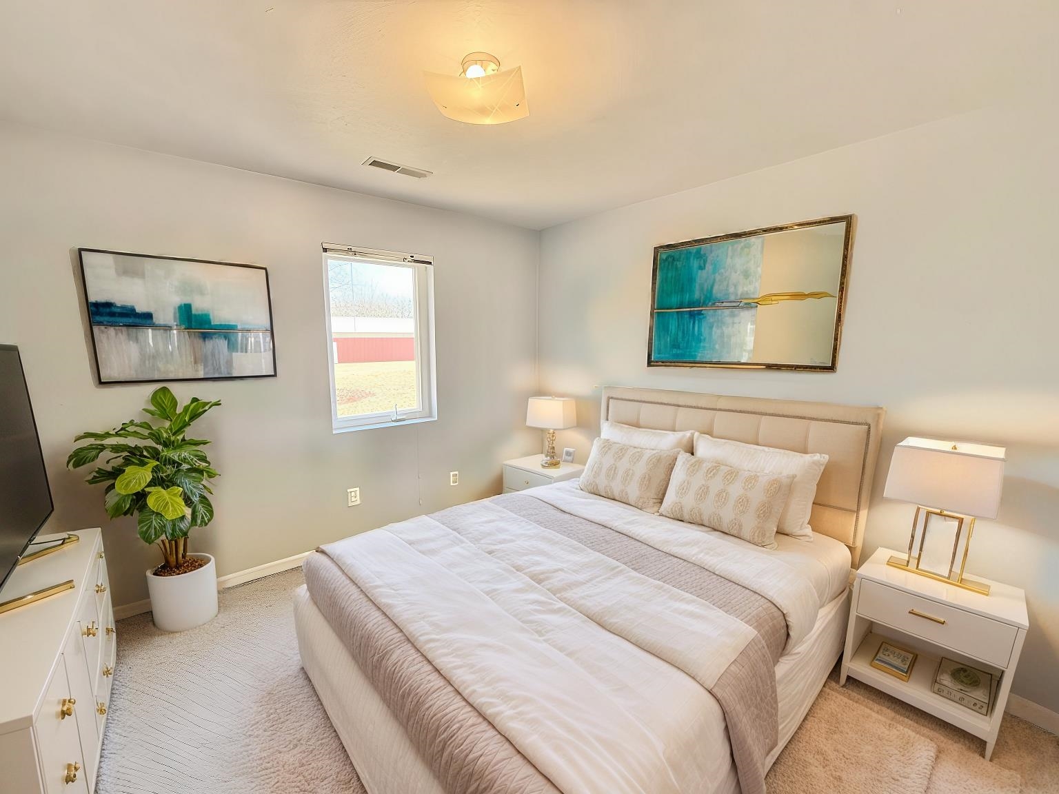 7188 Edwardsville Road Rockford, IL 61102 - Photo 44 of 73 a bedroom with a bed and a painting on the wall