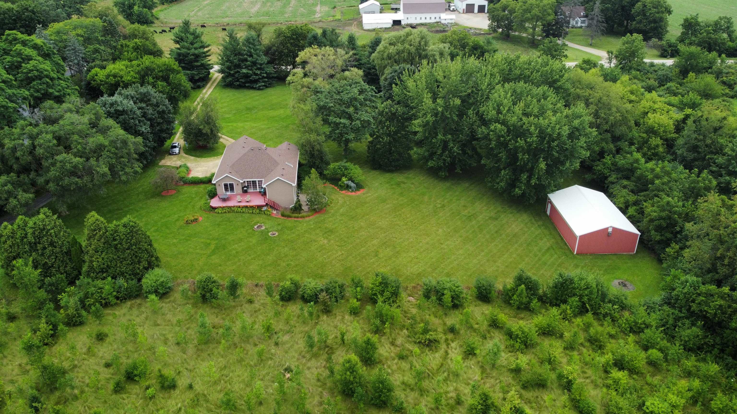 7188 Edwardsville Road Rockford, IL 61102 - Photo 53 of 73 a backyard of a house with a yard and seating area