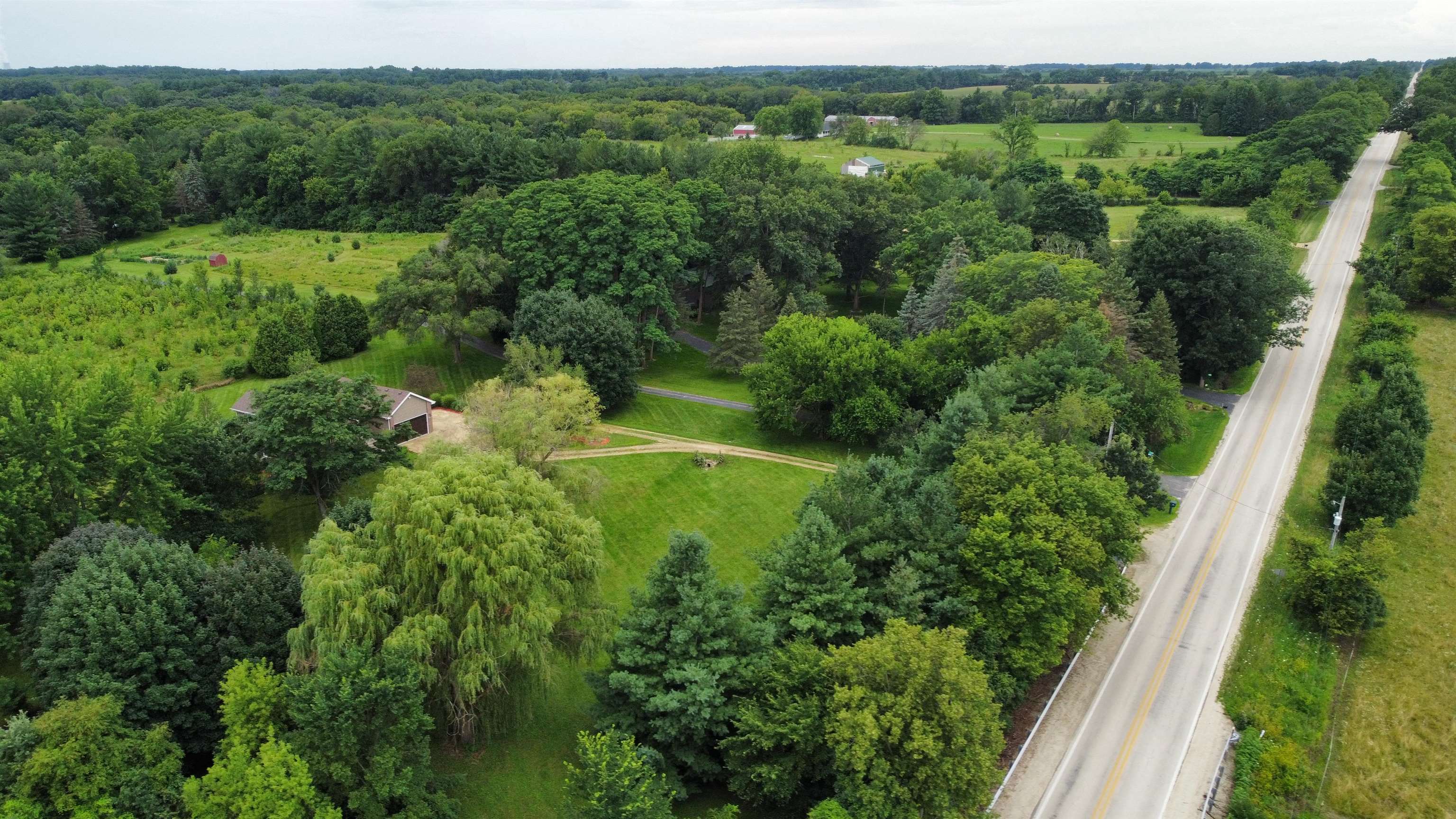 7188 Edwardsville Road Rockford, IL 61102 - Photo 60 of 73 a view of a lush green forest with trees in the background