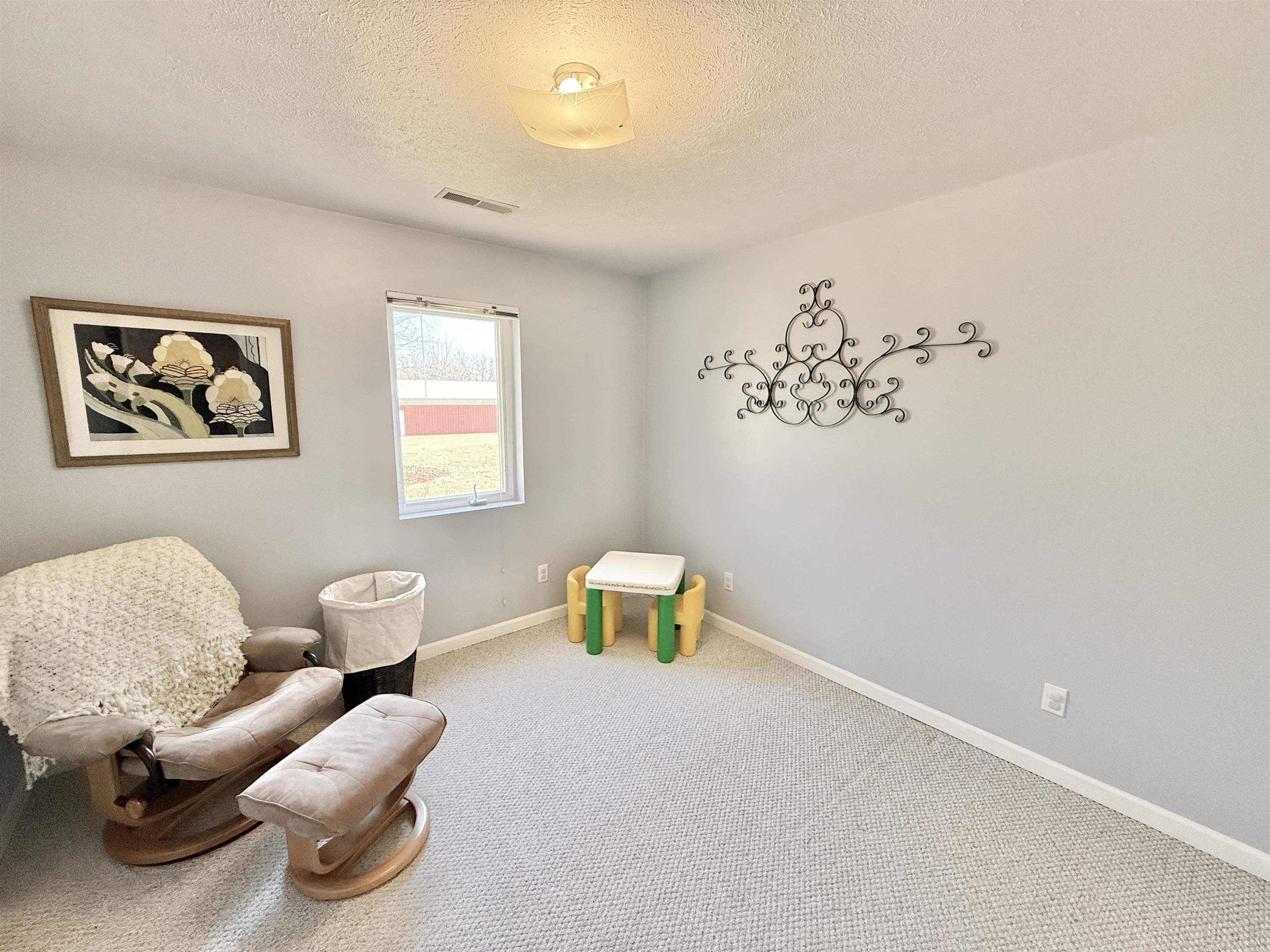 7188 Edwardsville Road Rockford, IL 61102 - Photo 72 of 73 a bedroom with furniture and a window