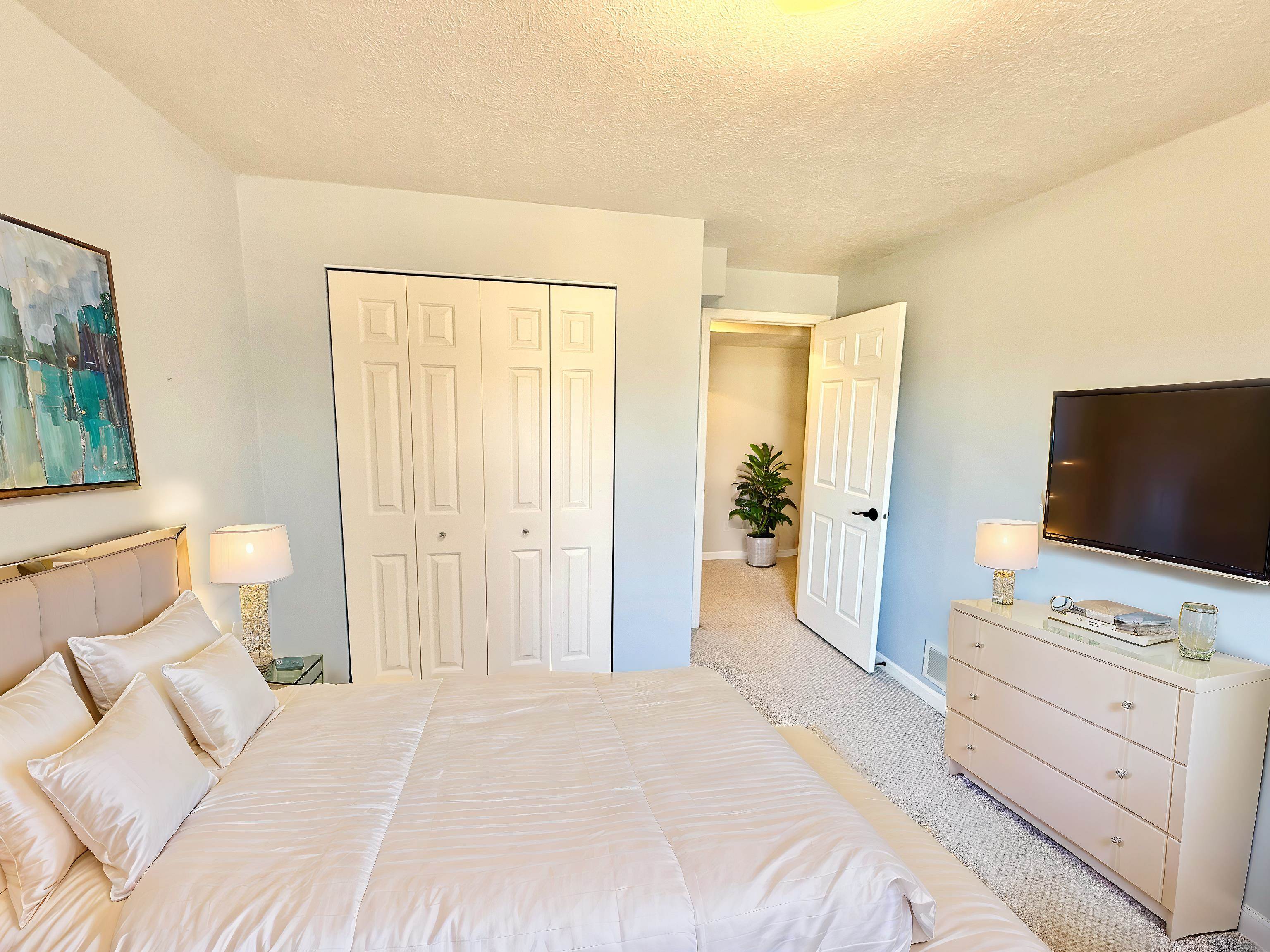 7188 Edwardsville Road Rockford, IL 61102 - Photo 73 of 73 a bedroom with a bed and a flat screen tv