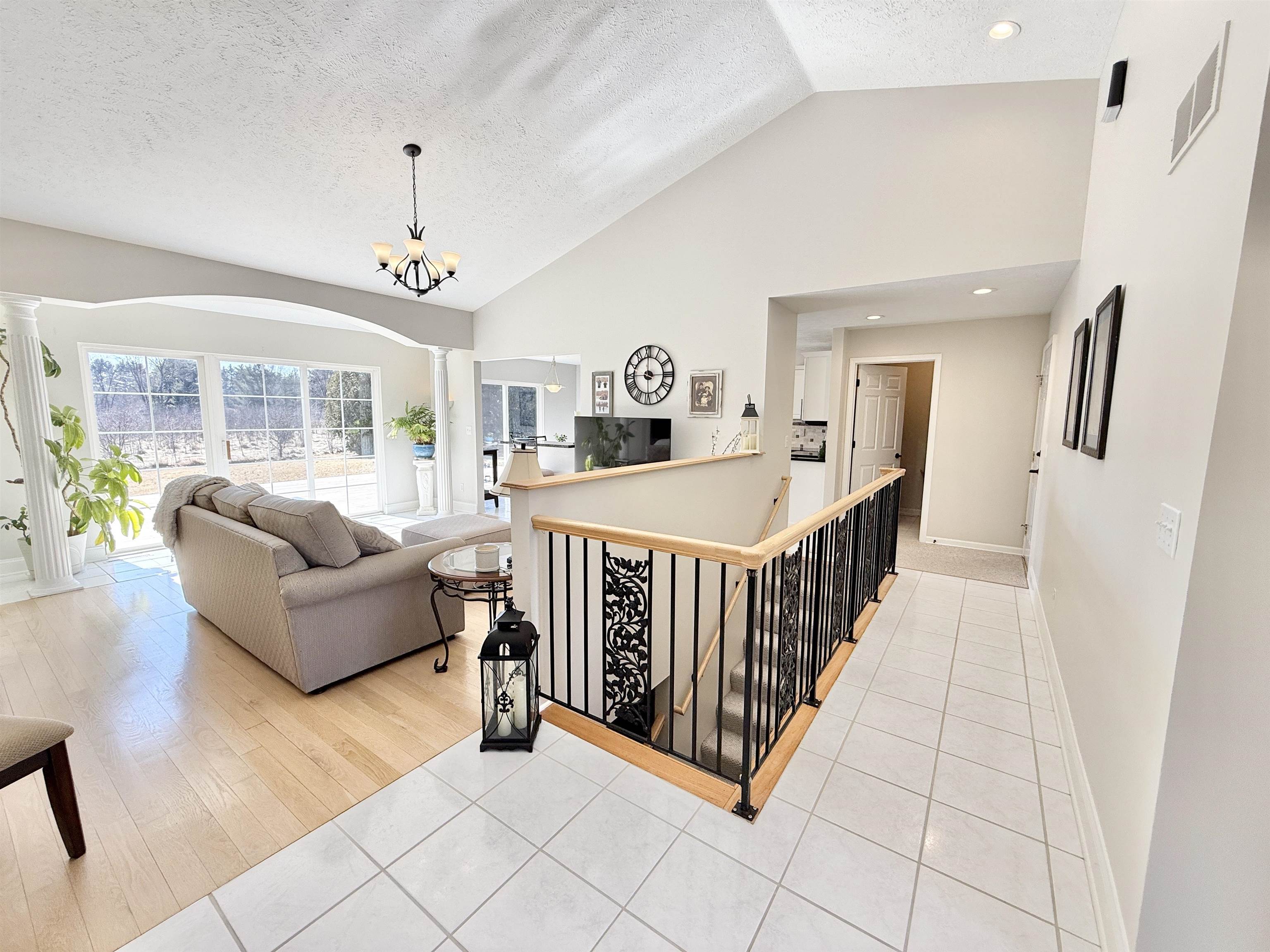 7188 Edwardsville Road Rockford, IL 61102 - Photo 8 of 73 a living room with furniture and a chandelier