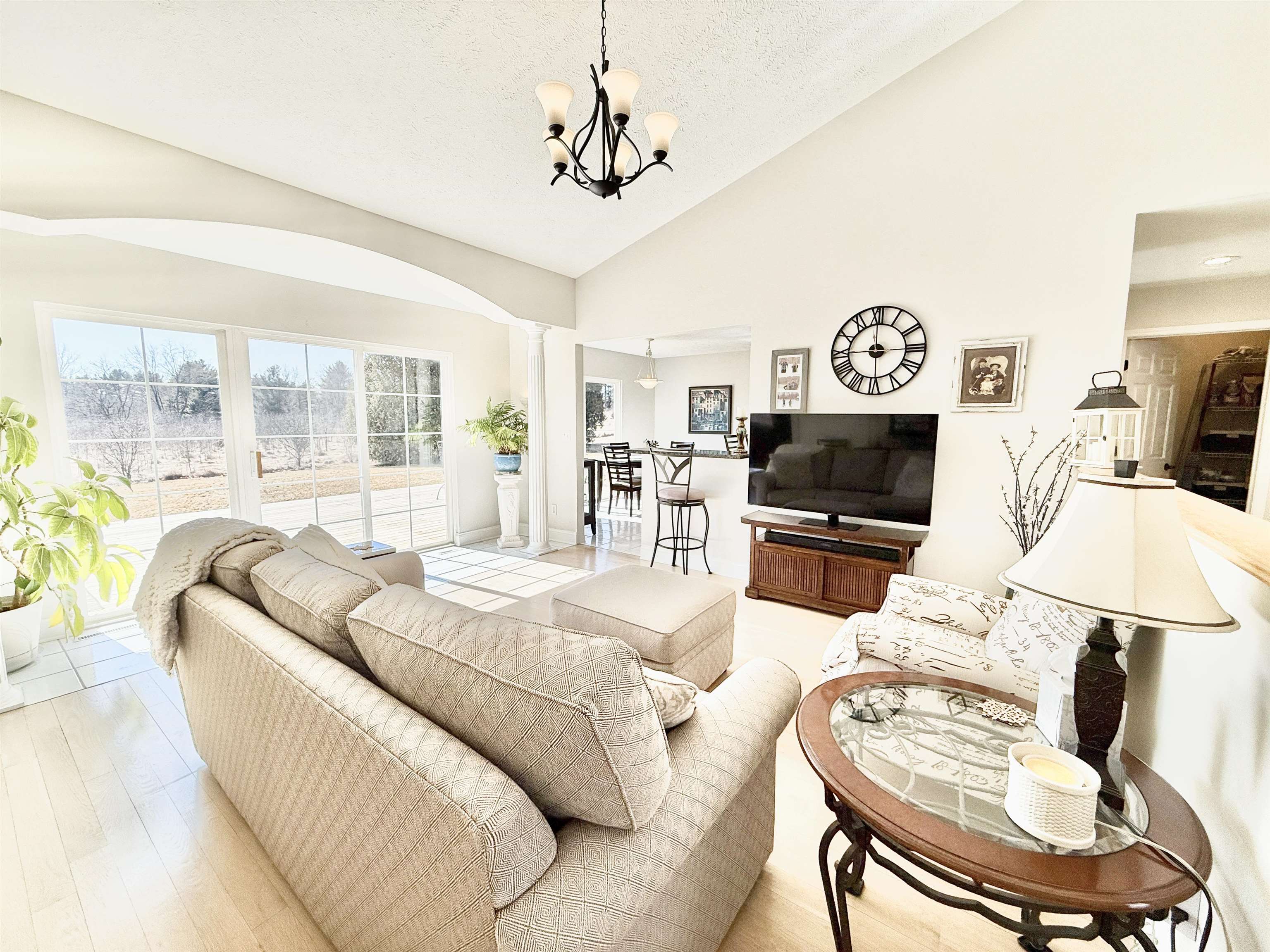 7188 Edwardsville Road Rockford, IL 61102 - Photo 9 of 73 a living room with furniture a flat screen tv and a large window