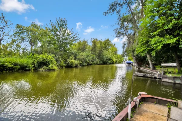 a view of a lake with a garden