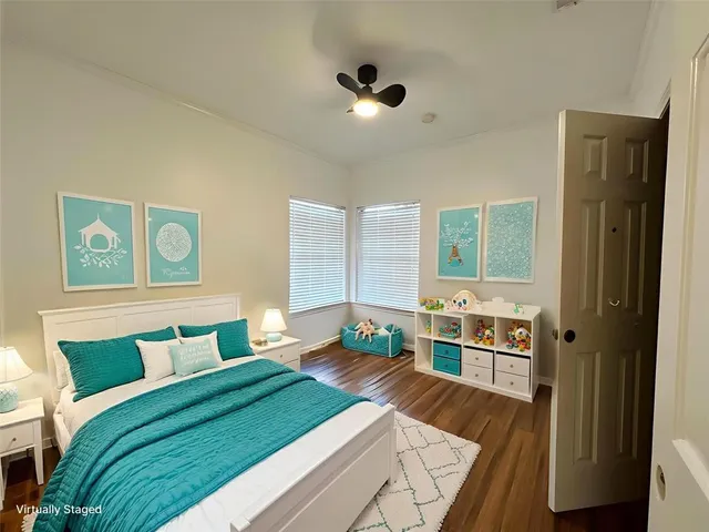 a bedroom with a bed and a table in it