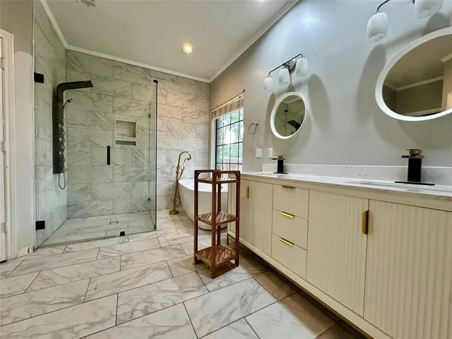 a bathroom with a sink mirror and window