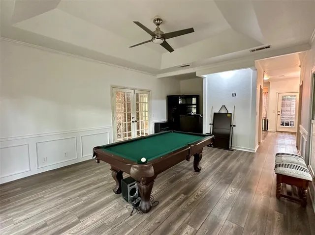 a bedroom with furniture and a wooden floor