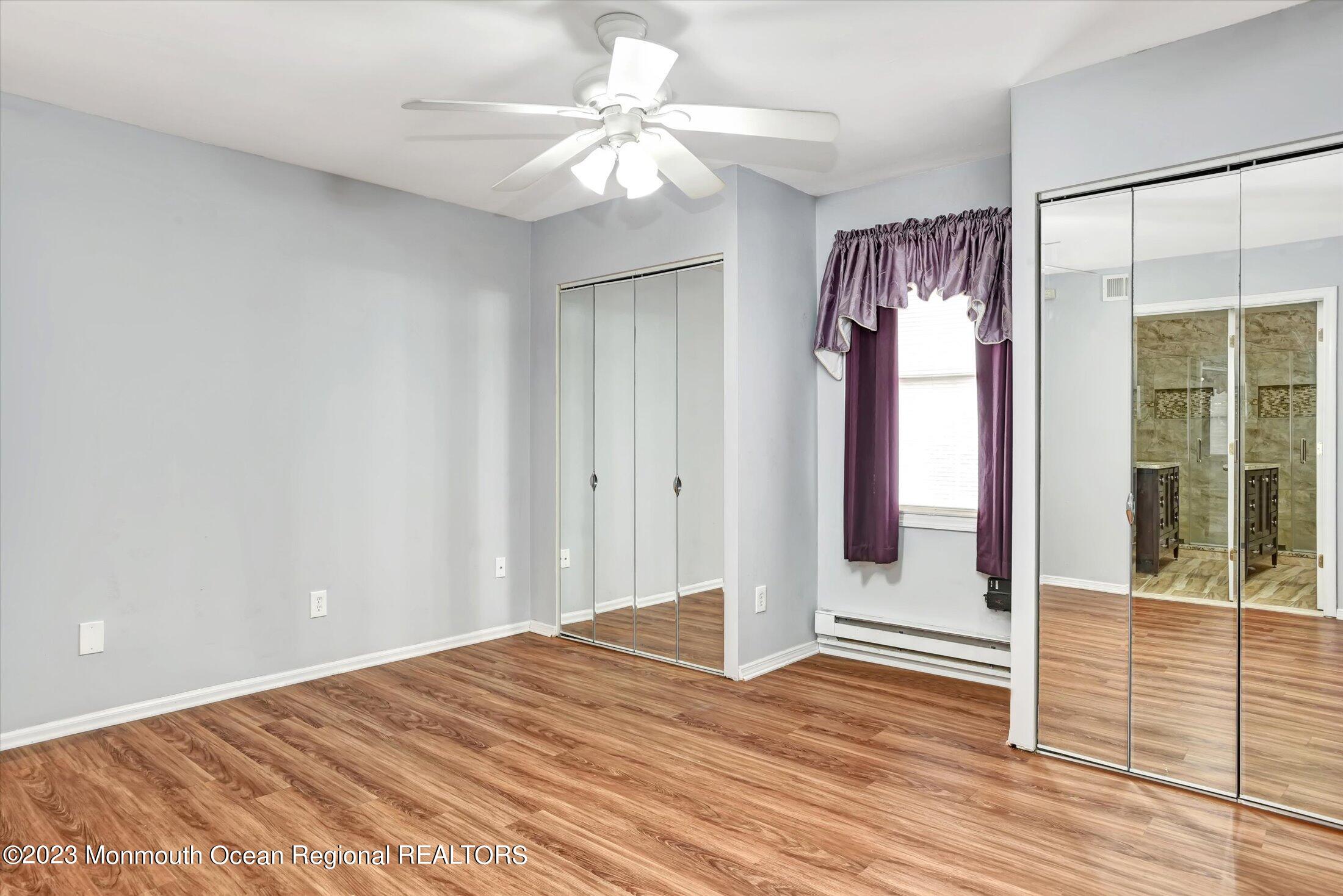 35 B Zacatin Road Freehold, NJ 07728 - Photo 17 of 35 wooden floor in an empty room with a window