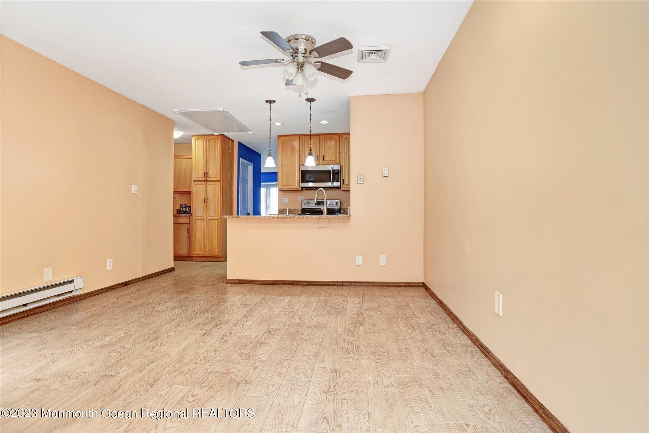 35 B Zacatin Road Freehold, NJ 07728 - Photo 5 of 35 a view of a kitchen with a sink and a refrigerator