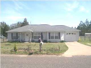 6143 Old Hickory Road Crestview, FL 32539 - Photo 1 of 1 front view of a house with a yard