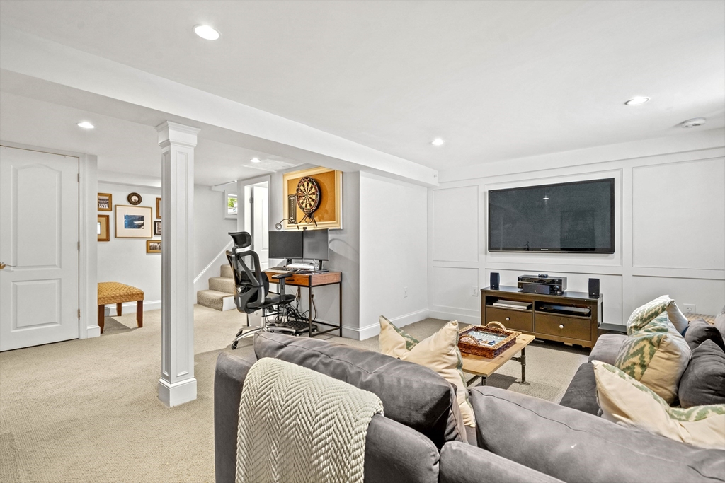 7 Leonard Circle Medford, MA 02155 - Photo 23 of 33 a living room with furniture and a flat screen tv