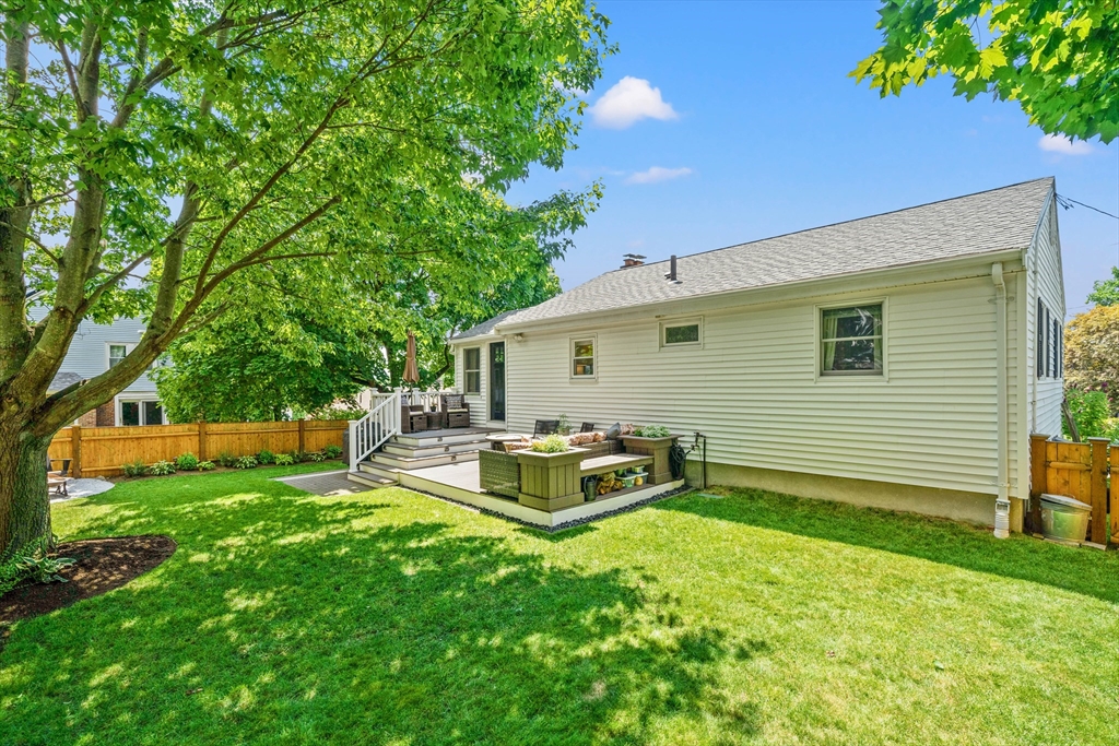 7 Leonard Circle Medford, MA 02155 - Photo 29 of 33 a backyard of a house with table and chairs