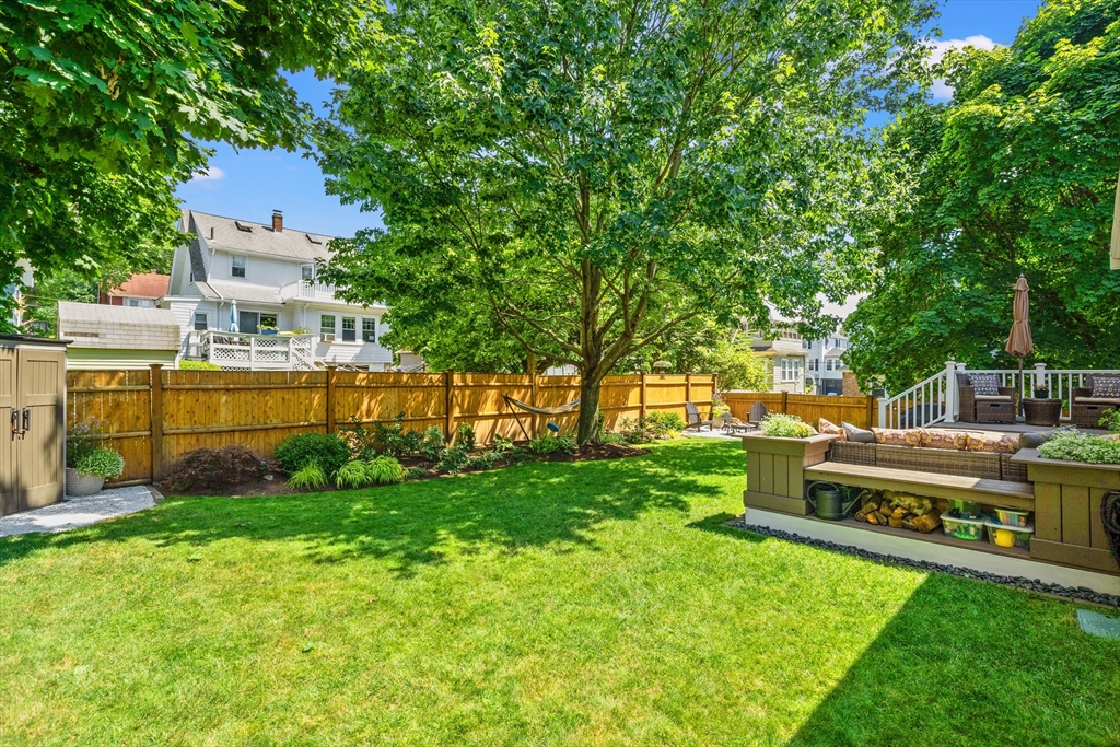 7 Leonard Circle Medford, MA 02155 - Photo 30 of 33 a view of a house with a yard and sitting area