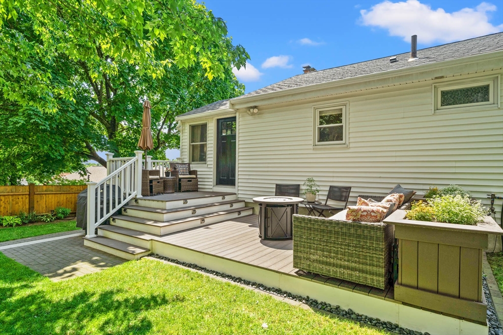 7 Leonard Circle Medford, MA 02155 - Photo 33 of 33 a view of a patio with chairs and a barbeque