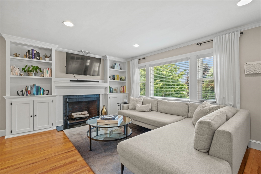 7 Leonard Circle Medford, MA 02155 - Photo 5 of 33 a living room with furniture fireplace and flat screen tv