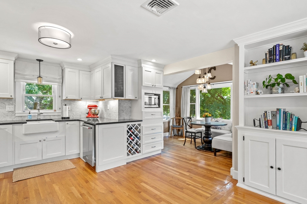 7 Leonard Circle Medford, MA 02155 - Photo 9 of 33 a kitchen with microwave a stove and cabinets
