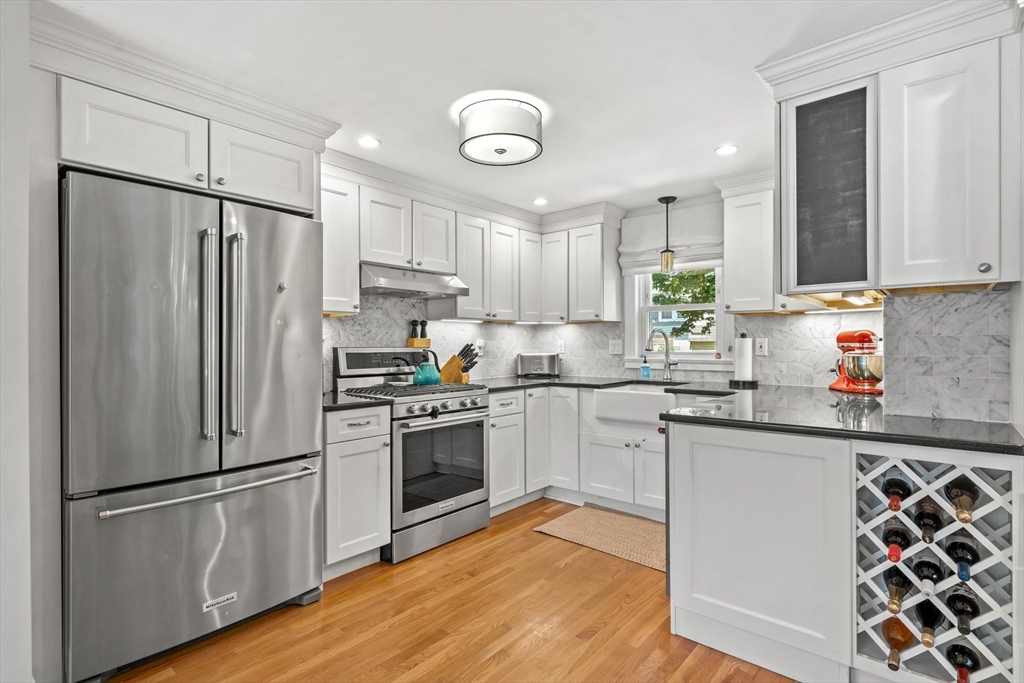 7 Leonard Circle Medford, MA 02155 - Photo 10 of 33 a kitchen with stainless steel appliances a refrigerator sink and microwave