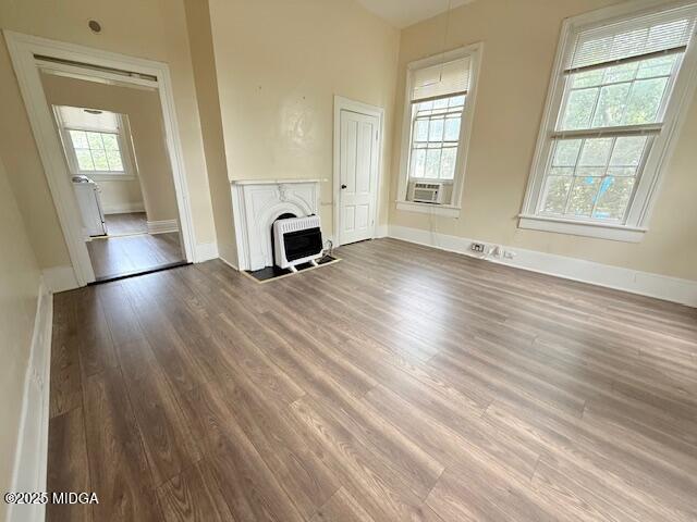 955 Cole Street, Unit 4 Macon, GA 31201 - Photo 4 of 7 a view of an empty room with wooden floor and a window