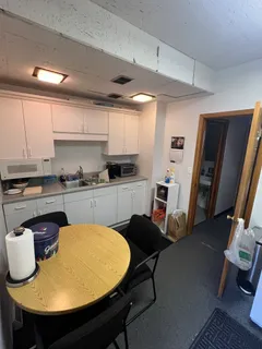 a kitchen with a sink appliances and cabinets