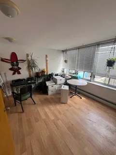 a room with gym equipment and a window