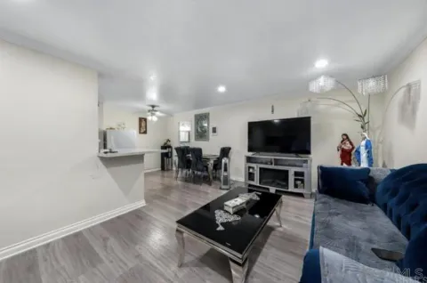 a living room with furniture and a flat screen tv