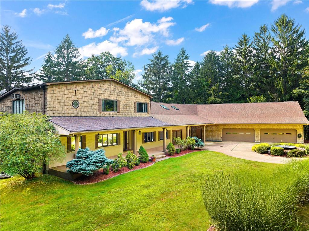 a view of a house with a big yard