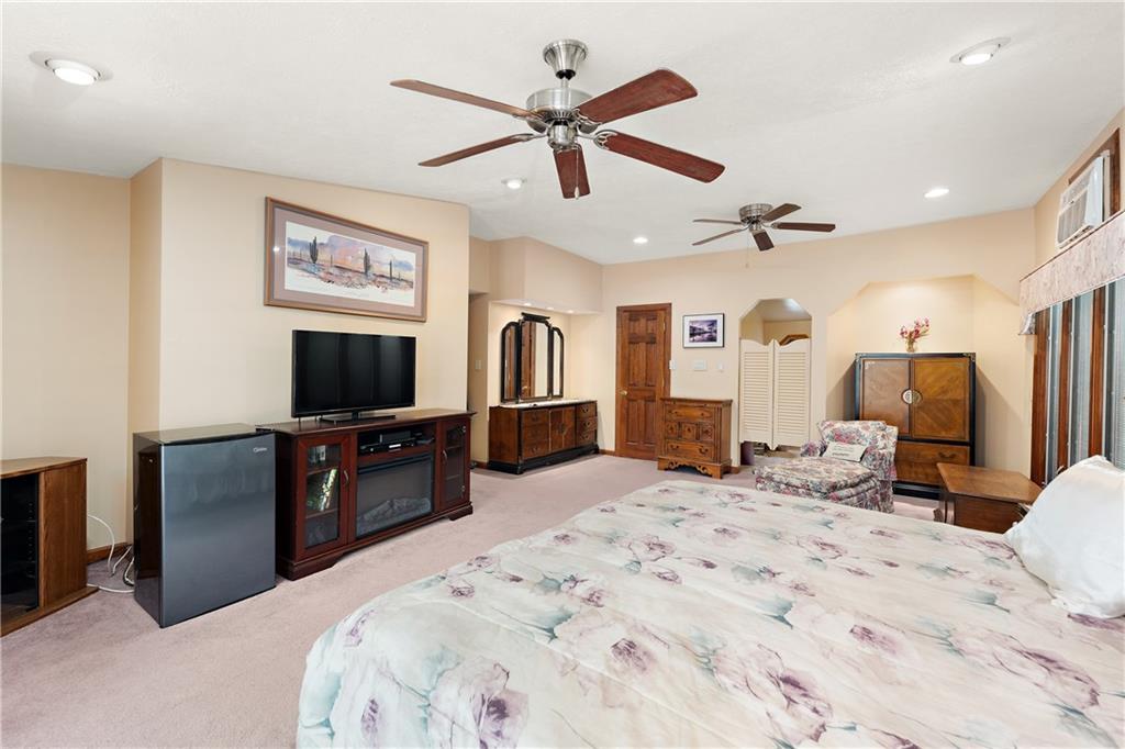 114 Pine Manor Sewickley, PA 15143 - Photo 21 of 40 a bedroom with a bed and a flat screen tv