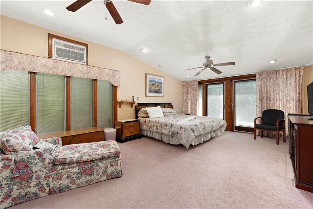 114 Pine Manor Sewickley, PA 15143 - Photo 22 of 40 a bedroom with furniture and large windows