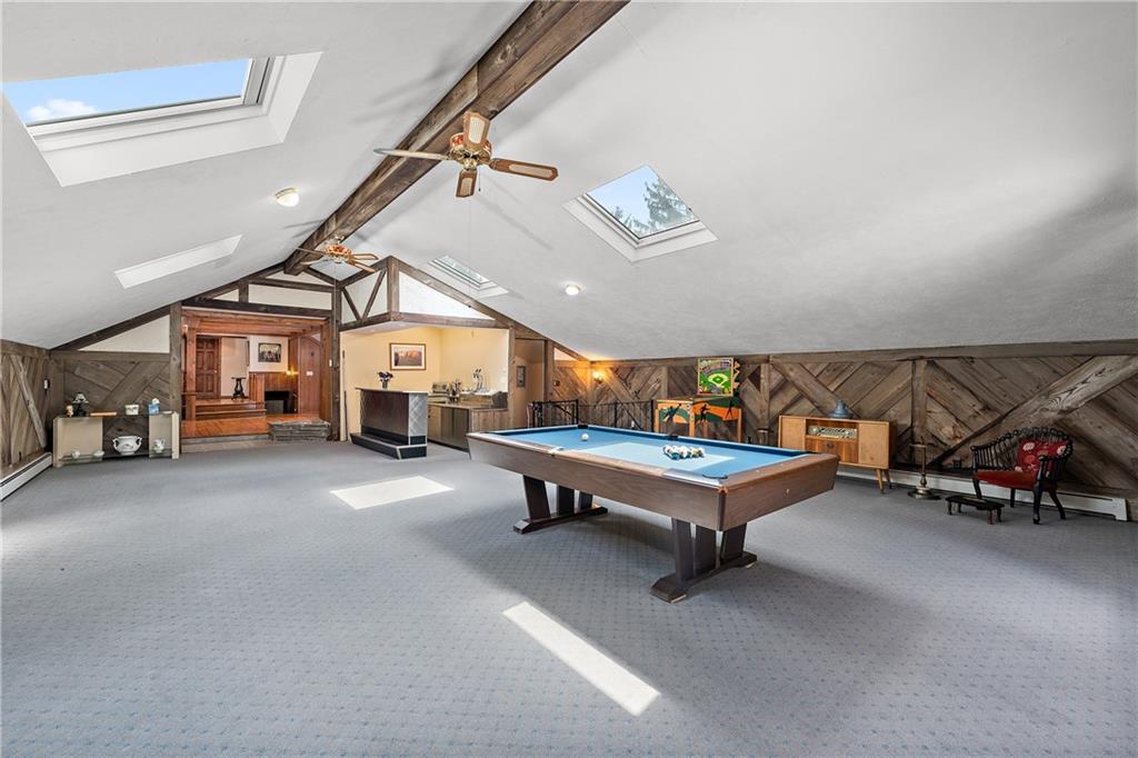 114 Pine Manor Sewickley, PA 15143 - Photo 30 of 40 a living room with lots of furniture and a chandelier