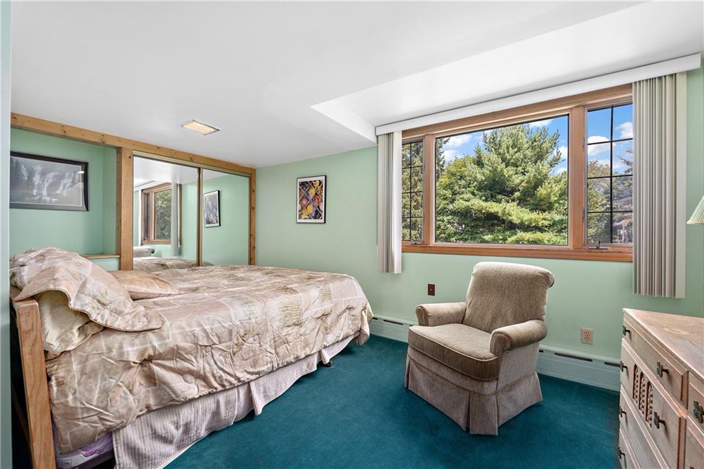 114 Pine Manor Sewickley, PA 15143 - Photo 31 of 40 a spacious bedroom with a bed and a large window