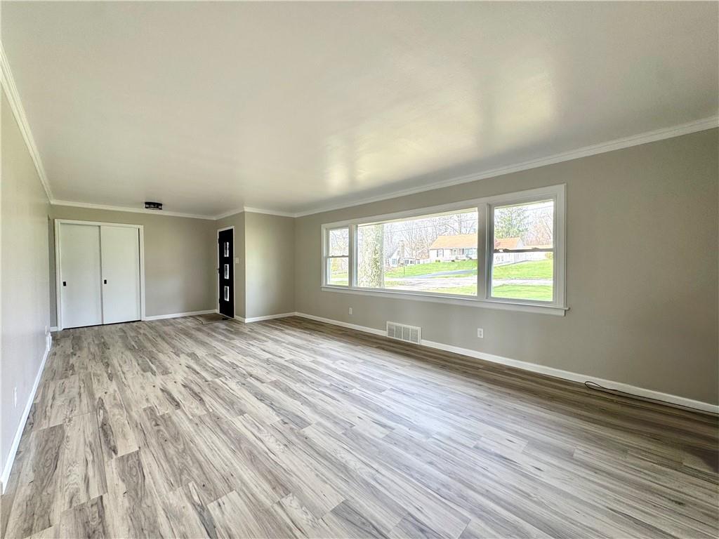 326 Frazier Drive New Castle, PA 16105 - Photo 13 of 32 Very large living room with plenty of space for lounging and watching TV.