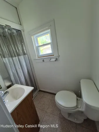 a view of a livingroom with furniture and a ceiling fan