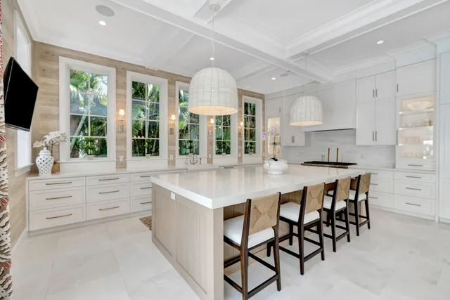 a kitchen with stainless steel appliances kitchen island granite countertop a stove and cabinets