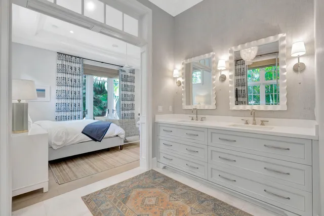 a bathroom with a granite countertop sink mirror and